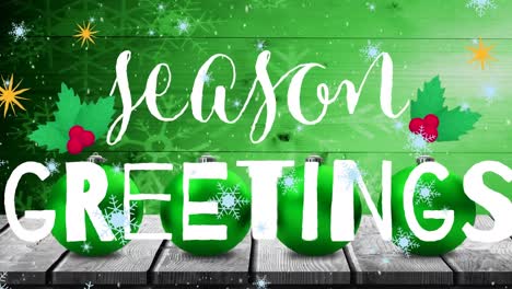 animation of snowflakes falling over seasons greetings text banner and baubles over wooden plank