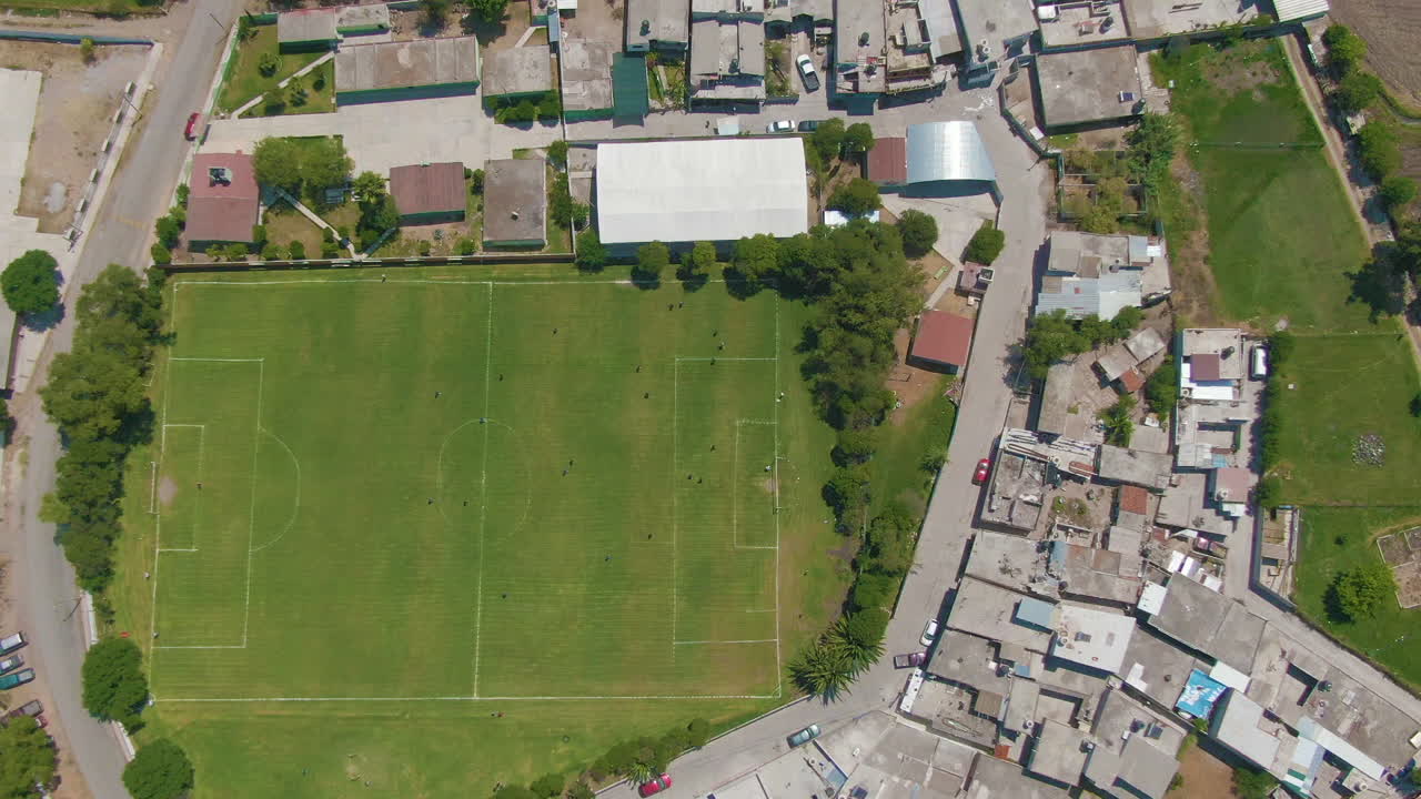 Young people playing soccer like every Sunday