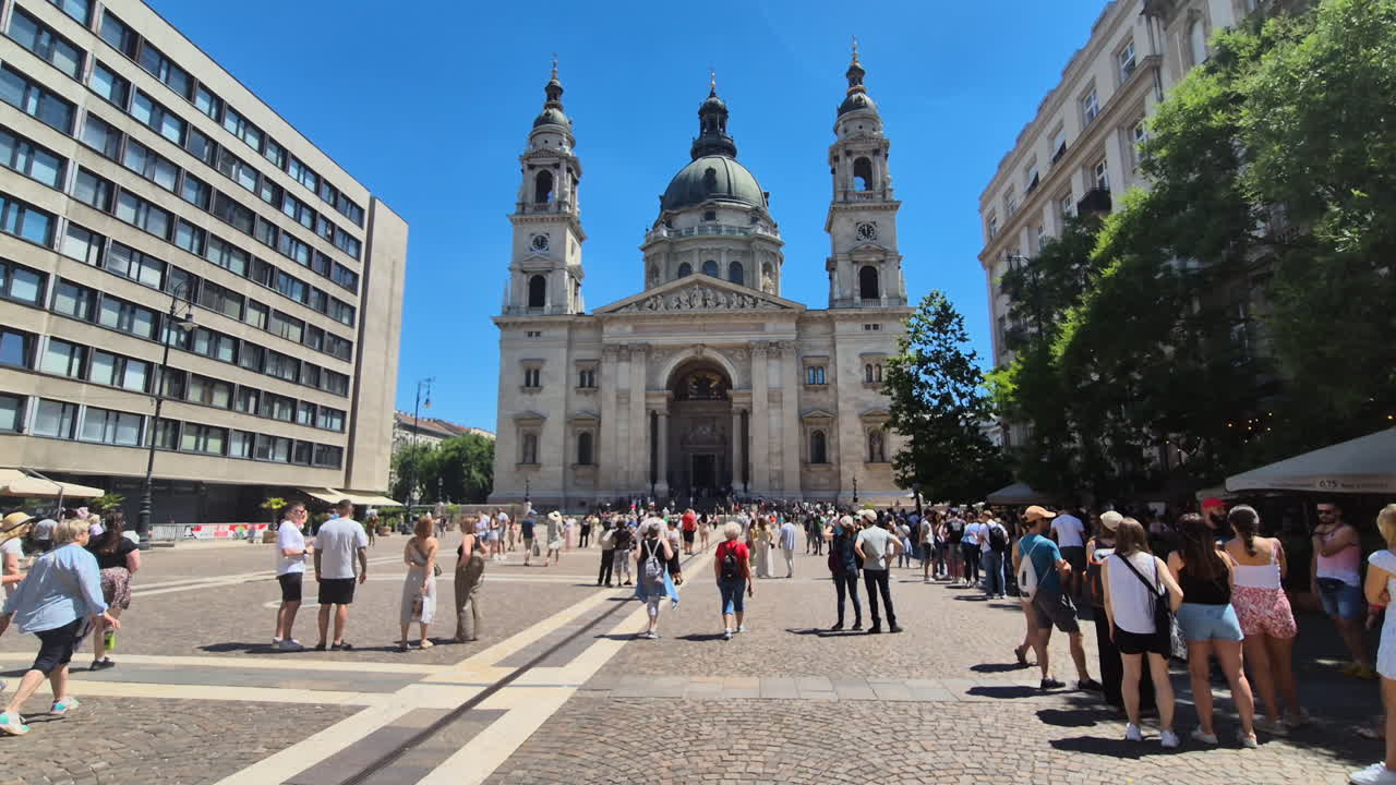 The crowded town square Szent Istvan ter and the St. Stephen's basilica in Budapest, Hungary