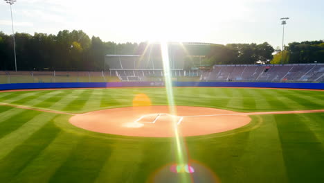 baseball field ready for game day at dusk with bright sunlight