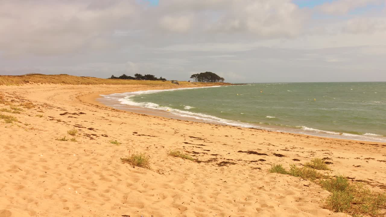 Experience the tranquil beauty of a sea beach paradise with golden sands and gentle waves. Perfect for relaxation, this location captures the mood of serenity and peace on a cloudy day