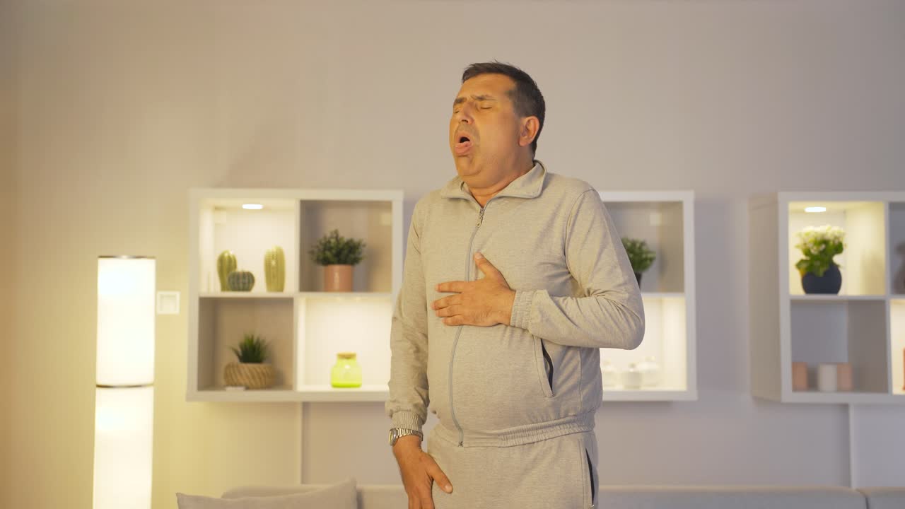 The sick man can't stop coughing.