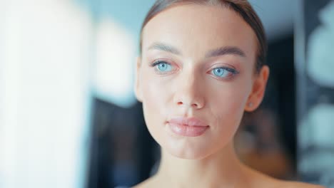 portrait of a beautiful woman with stunning blue eyes