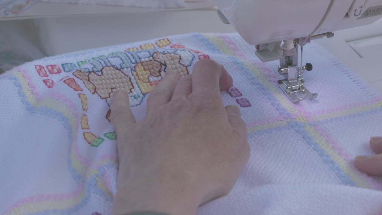 sticthes being put into a baby blanket to finish the final design