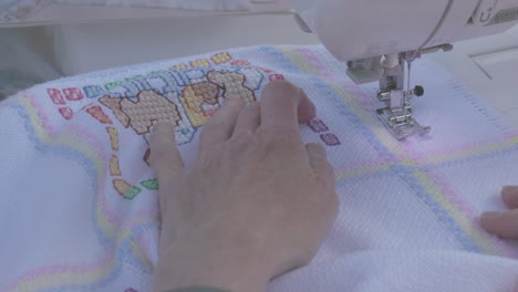 sticthes being put into a baby blanket to finish the final design