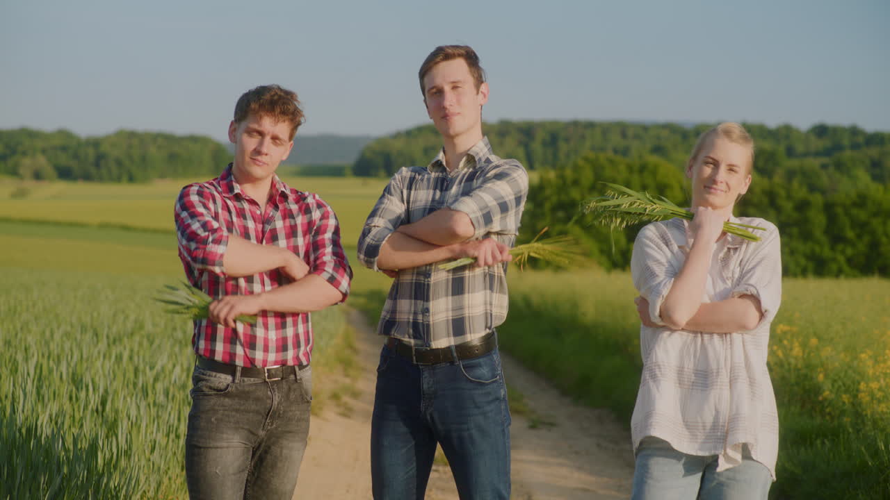 Three Young Farmers Portrait Shot in Rural Landscape