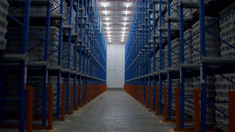 worker open door of a storage in warehouse with pallet racking system