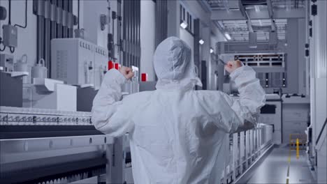 back view of asian male scientist celebrating the succeed while standing at pharmaceutical factory, vaccine production facility
