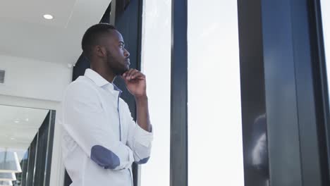 Young-man-looking-through-the-window