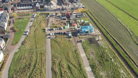 high angle view of construction site at the edge of a newly built suburban neighborhood