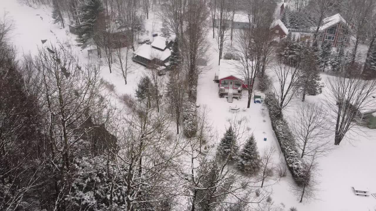 Scenic snow-covered forest landscape with a winding river in countryside, Sherbrooke, Canada.
