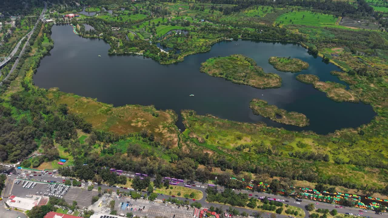 Sunny day shot of a very green lake in Xochimilco Ecological Park in CDMX during rainy season