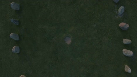oval shaped ancient rocks ales stenar in south sweden skåne österlen kåseberga, aerial ascending smooth bird view