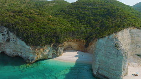 aerial view of a beautiful coastal beach with turquoise water and white cliffs