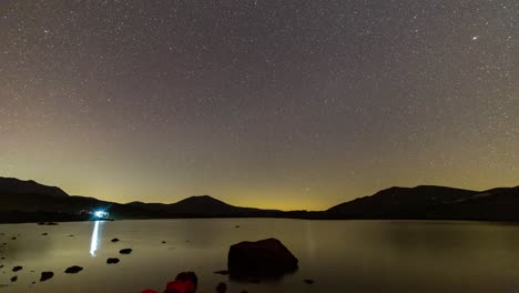 magnificent moving milky way over the lake in high mountains in iran and camping near the lake landscape of beautiful dark starry night sky