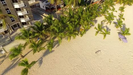 Pedestal-drone-shot-revealing-the-apartments-and-condominiums-by-the-beachfront-of-Miami,-located-in-Itea-in-Central-Greece