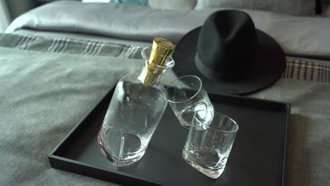 empty luxury whiskey bottle and glasses, close up