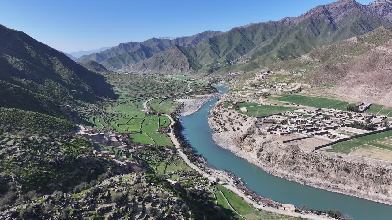 Asmar District, Kunar river valley drone aerial with beautiful Hindu Kush mountains, forests and village, Afghanistan
