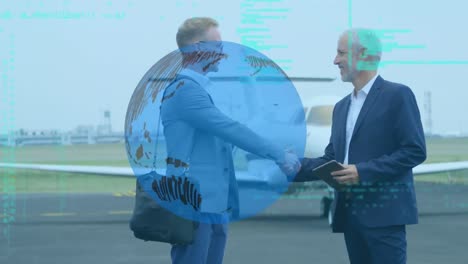 spinning globe and data processing over two caucasian businessmen shaking hands at airport runway