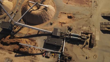 aerial top down shot of production pipeline in paper mill factory during sunlight