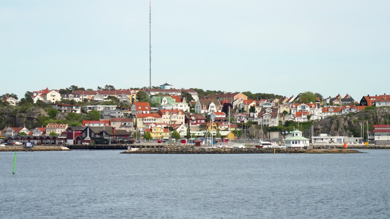 Colorful Houses On Hillside Of Stromstad In Bohuslan, Sweden. wide shot