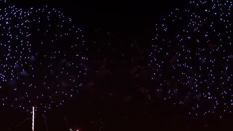 colorful fireworks exploding in the night sky. celebrations and events in bright colors.