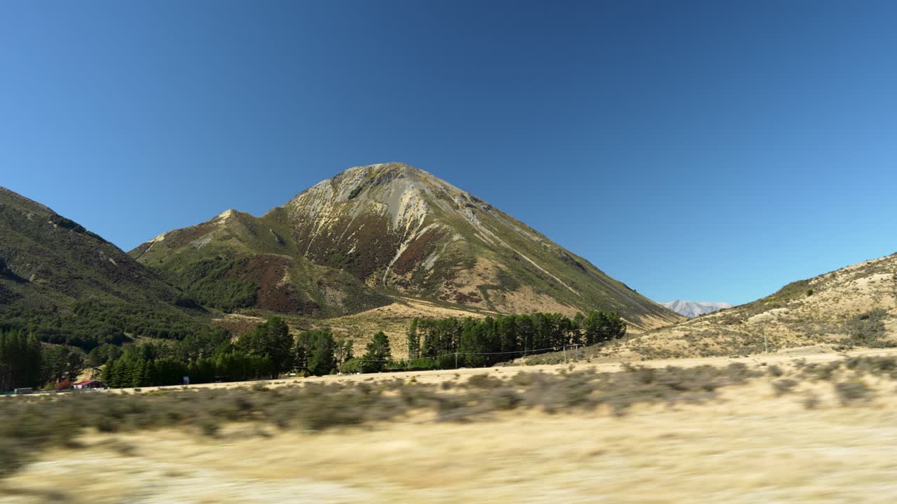 Driving through Arthur's Pass alongside the scenic Waimakariri River with a stunning view