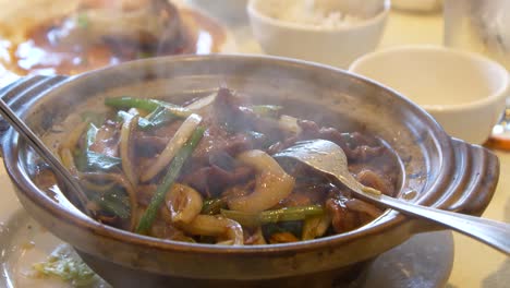 steaming-hot-pot-of-beef-and-onions