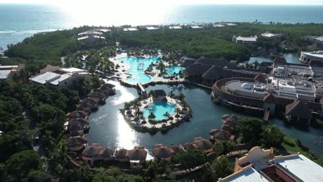 aerial view of luxury caribbean resort hotel and pools on mexican coast, yucatan