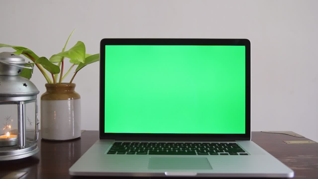 A laptop with a green screen which can be removed to place any content as per the requirement