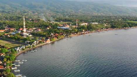 aerial-of-coastline-of-Lovina-Beach-in-Bali-Indonesia-during-golden-hour-sunset-on-a-sunny-summer-day
