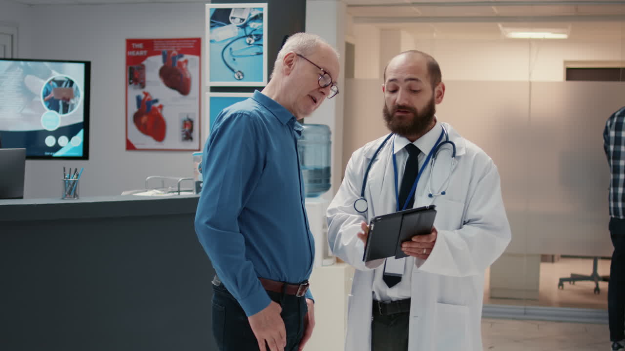Doctor Consulting with Patient in Hospital Waiting Room