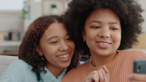 women, phone selfie or bond in house living room