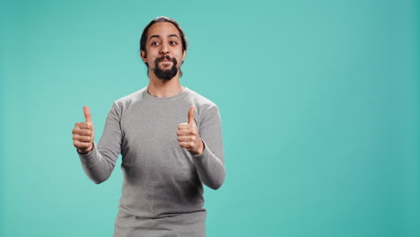 joyful person being excited, doing thumbs up hand gesture