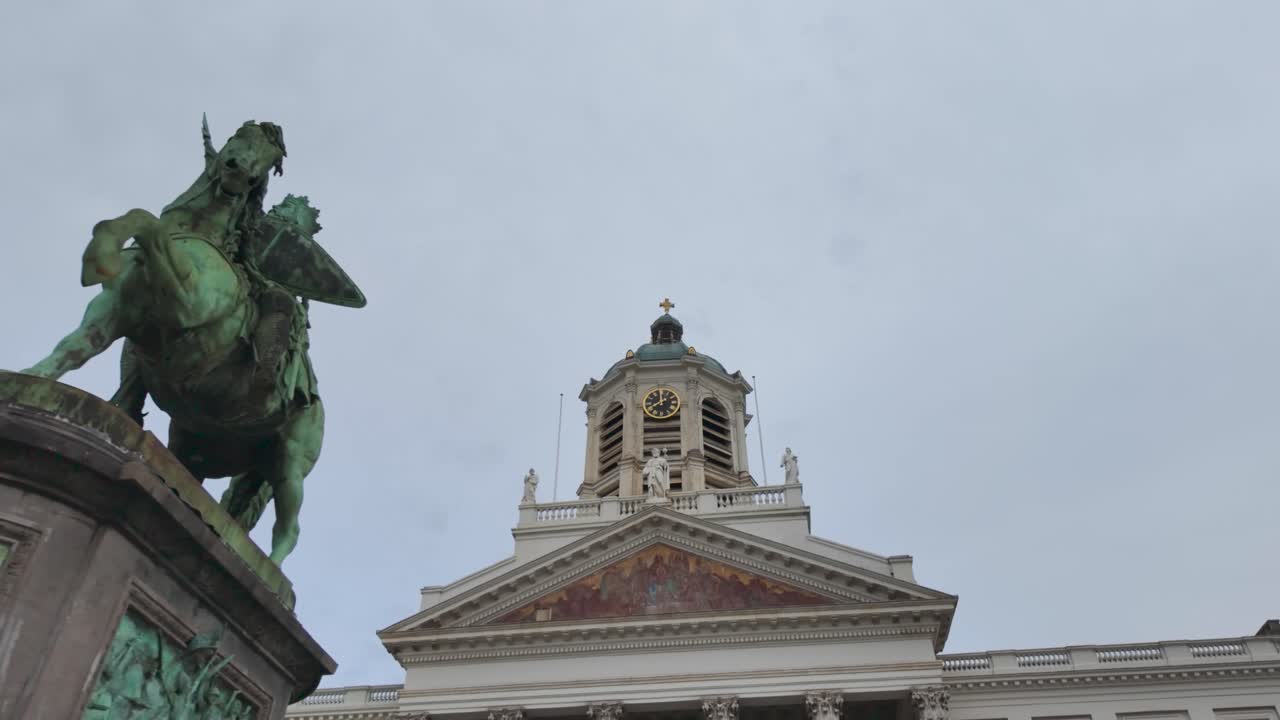 Equestrian statue of Godfrey of Bouillon with flag and shield, Place Royale and Church of Saint Jacques sur Coudenberg in Brussels, Belgium