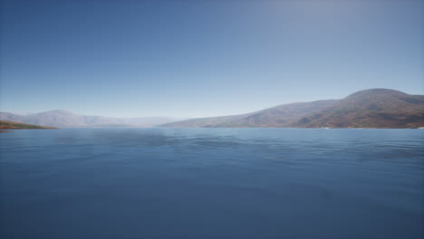 lake in hills on summer day