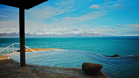 outdoor icelandic thermal spa with breathtaking view of the nordic ocean and majestic snowy mountains the distance