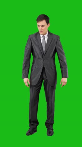 businessman expressing confusion and indecision on green screen