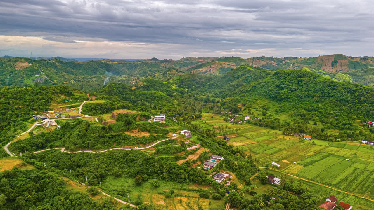 Stunning aerial timelapse of Selong Belanak showcasing dynamic cloud movement and lush natural surroundings. Perfect for travel, nature, and landscape visuals.