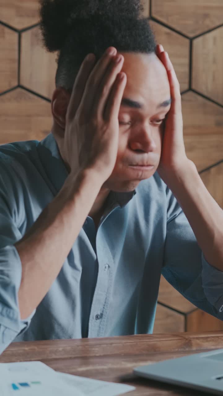 Focused individual engages in creative digital work at modern workspace