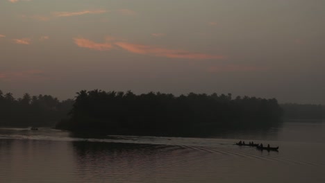 sunrise in backwaters,fishermen arriving shore,up angle view