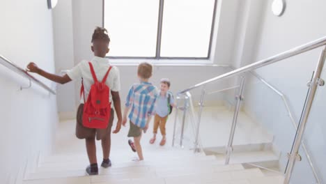 Video-of-diverse-boys-walking-on-stairs-at-school