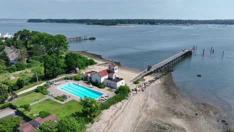 aerial view of a private beach with pool and pier
