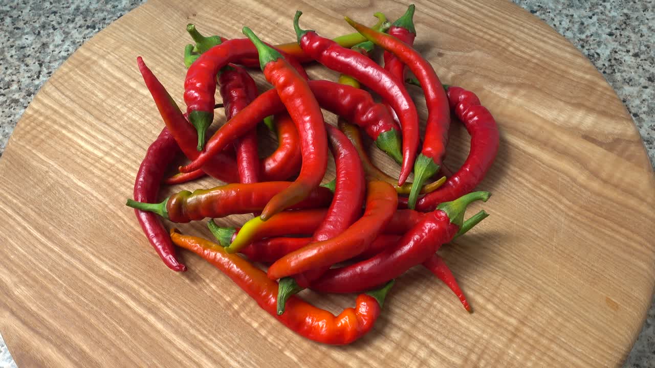 Red chilli, pepper. Shooting in the movement. Shooting in kitchen