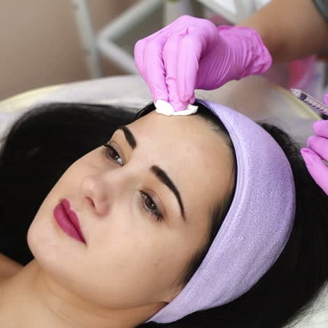 hands of cosmetologist making injection in face. aesthetic cosmetology. rejuvenating facial injections. cosmetologist job.