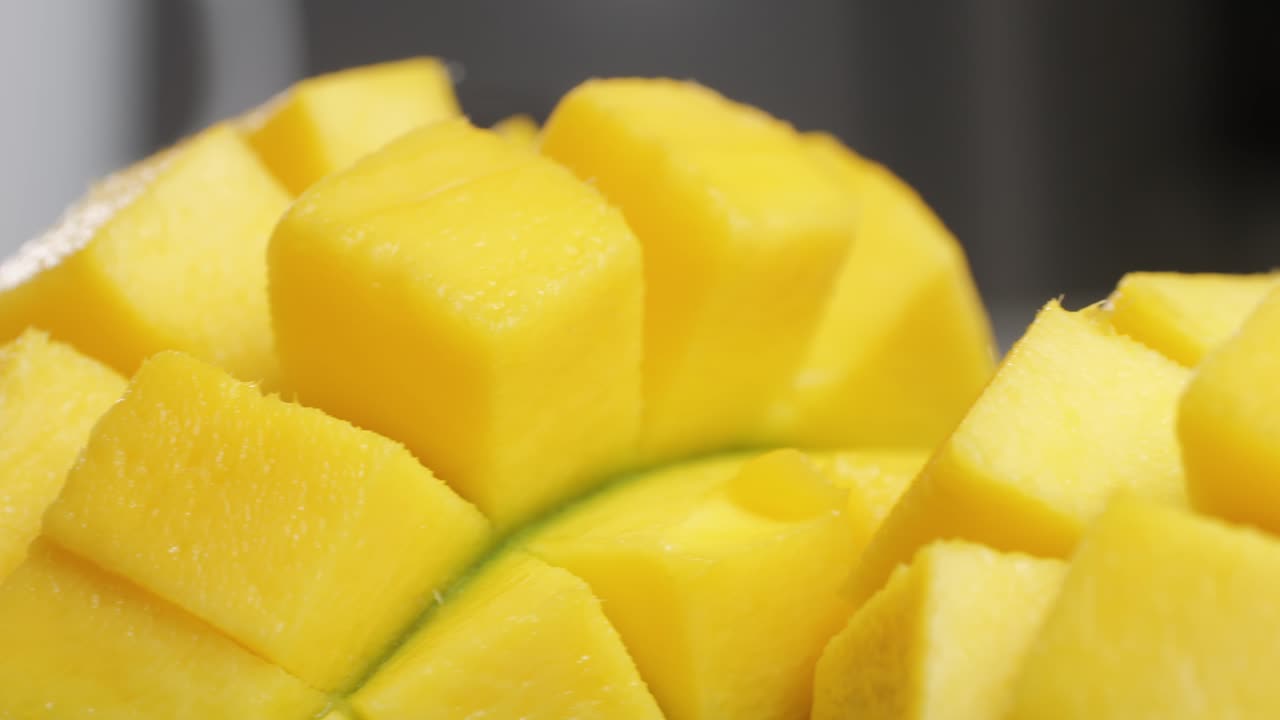 Close up rip mango slice cubes cut. High quality 4k footage