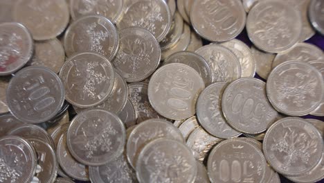 pile of five hundred yen coins, close up of japanese money