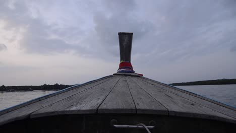 landscape of the head front of local boat while sailing in sea ocean in early morning time