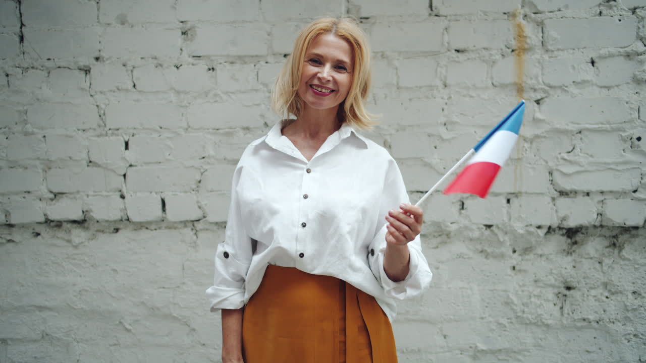 Woman holding a French flag
