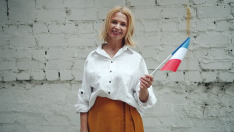 woman holding a french flag